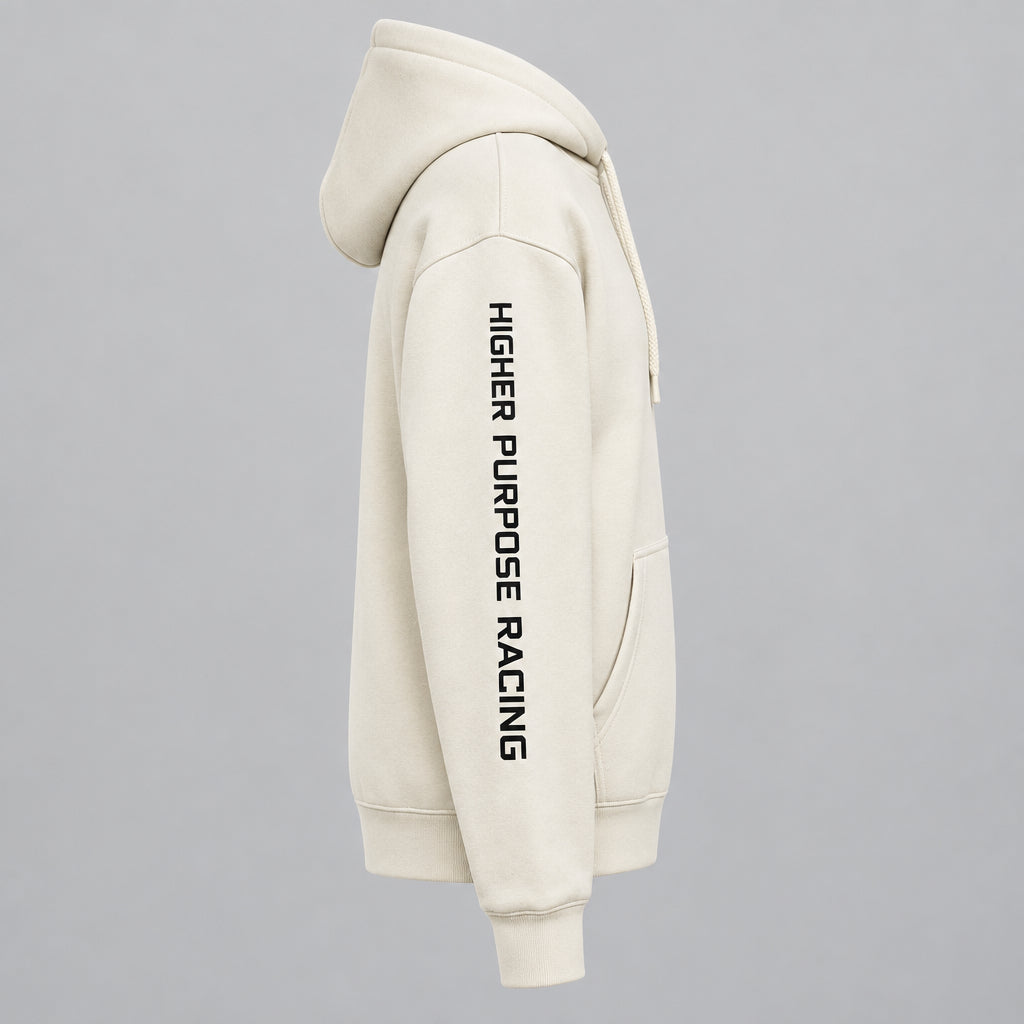 Close-up of a cream-colored hoodie with 'HIGHER PURPOSE RACING' printed vertically in black on the right sleeve, and partial 'GRADUATE' text visible on the chest.