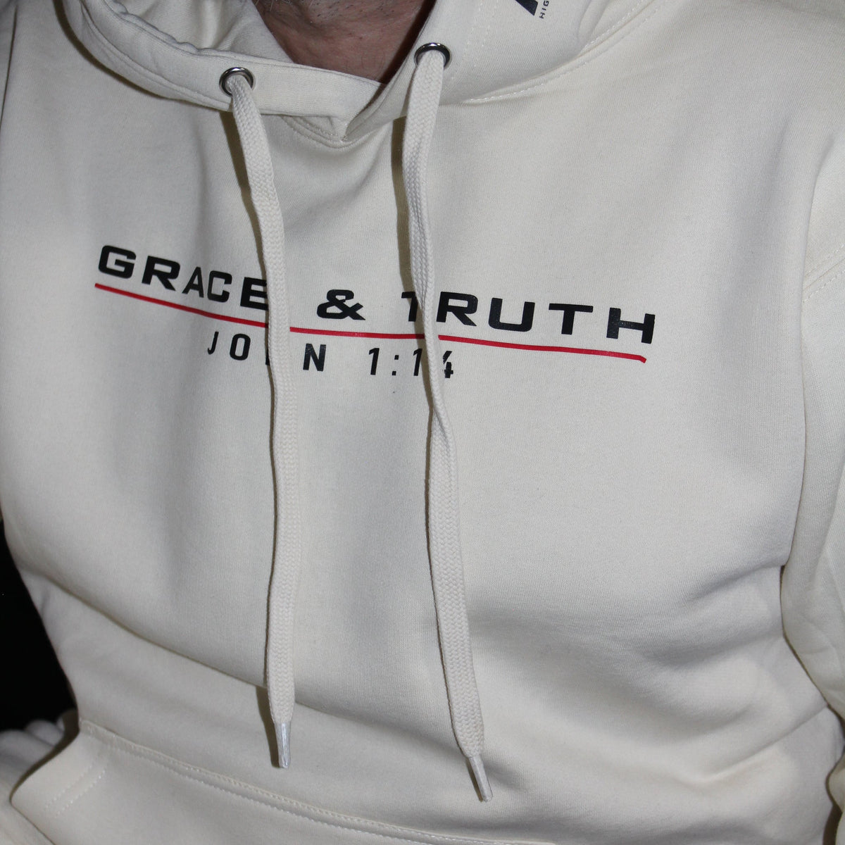 Grace & Truth John 1:14 chest print on the Vintage Pearl hoodie, worn