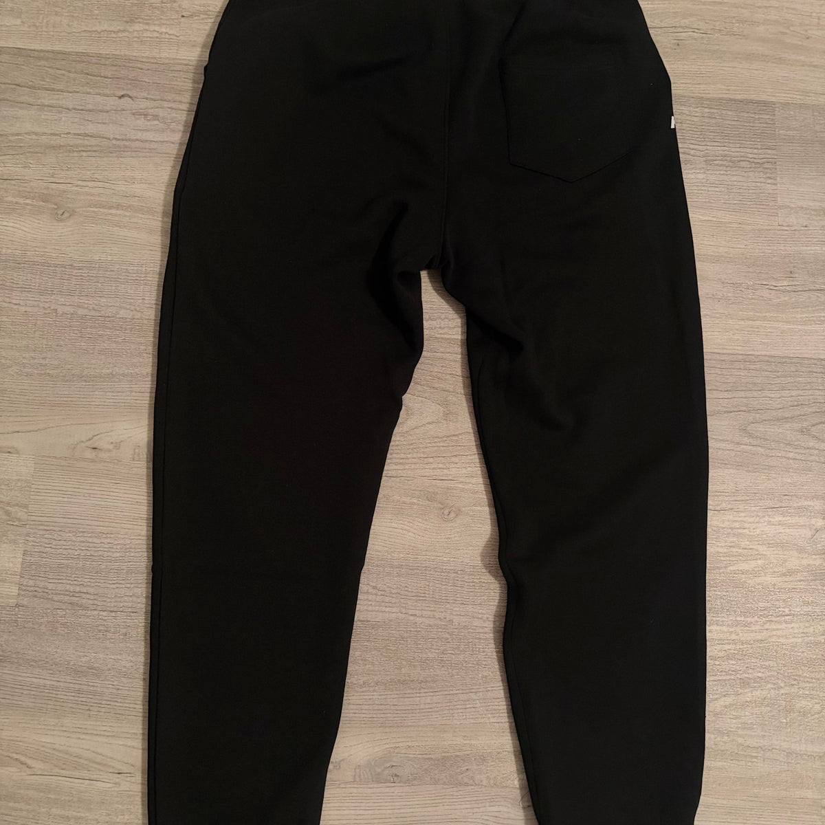 Back of the black Team Grace & Truth sweatpants