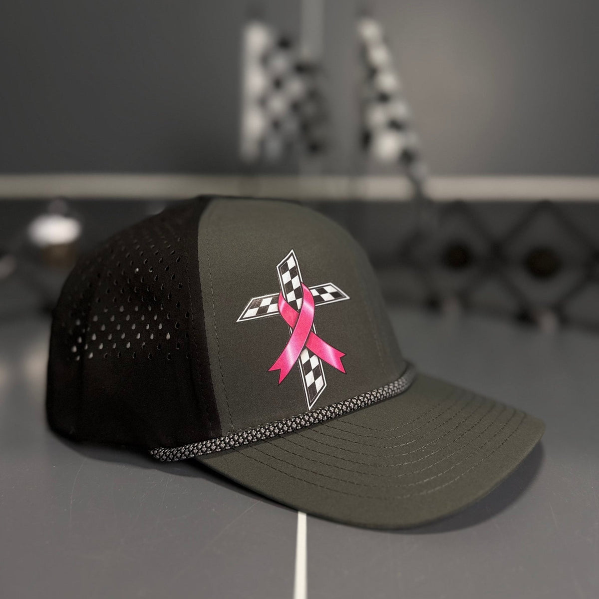 Angled view of the HPR Pink Ribbon Checkered Cross Hydro Rope Hat