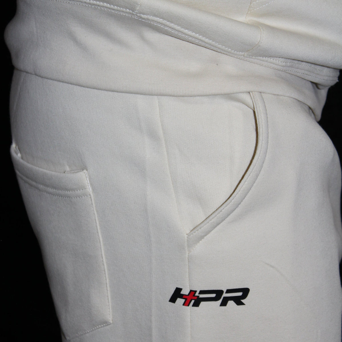 HPR logo at the hip of the Vintage Pearl sweatpants, worn