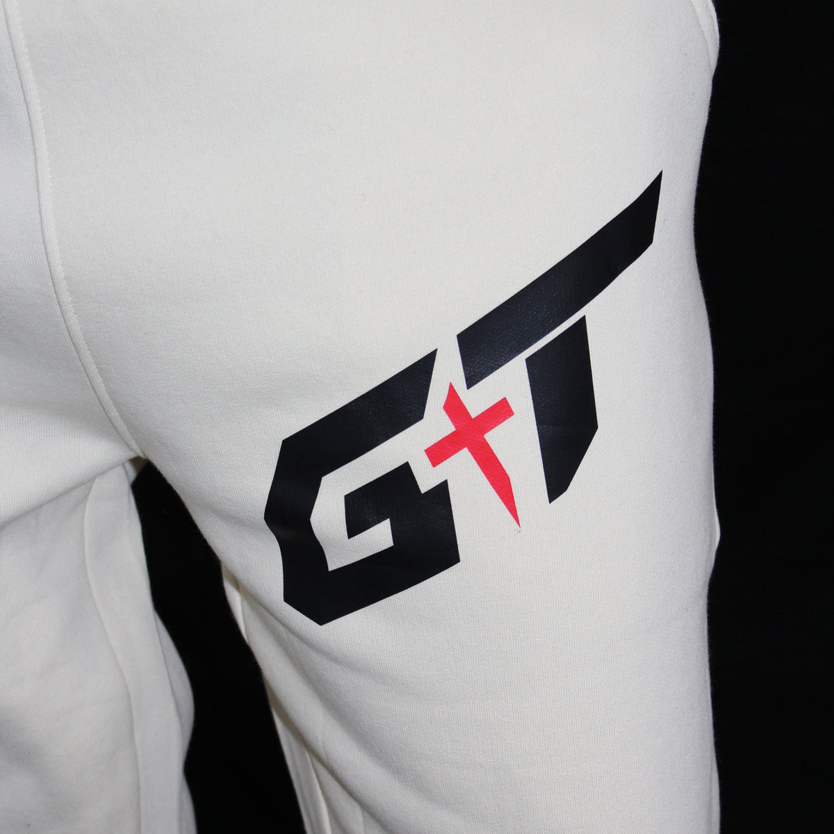 GT mark on the thigh of the Vintage Pearl sweatpants, worn
