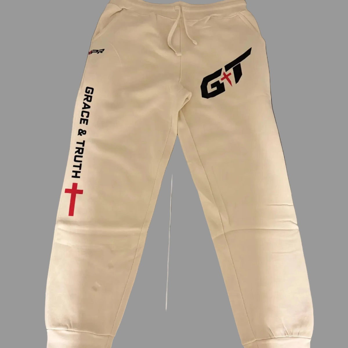 Vintage Pearl Team Grace & Truth sweatpants laid flat with GT thigh mark and Grace & Truth leg print